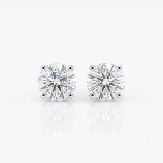 Classic diamond studs with sparkling round-cut crystal detailing and an anti-tarnish silver finish, perfect for everyday wear and elegant styling.
