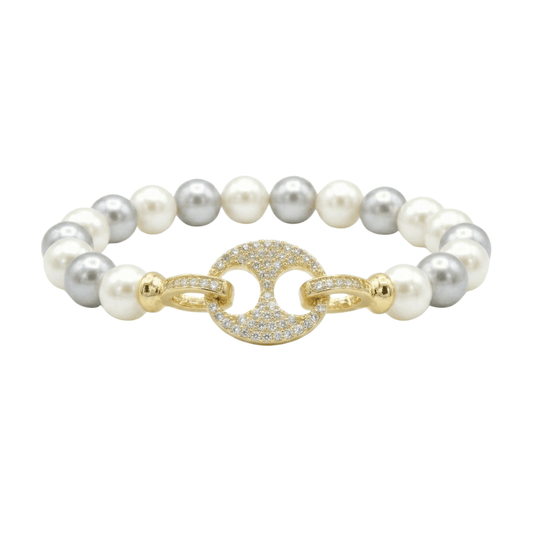 Coastal pearl bracelet with a crystal mariner link and an anti-tarnish finish, available in gold and silver, perfect for everyday wear and elegant styling.
