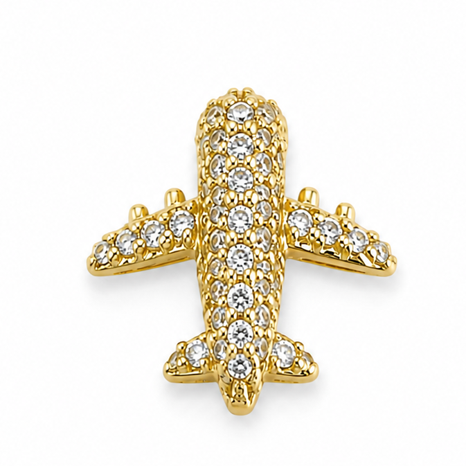 Gold airplane jewellery charm embellished with multiple clear crystal stones on a white background.