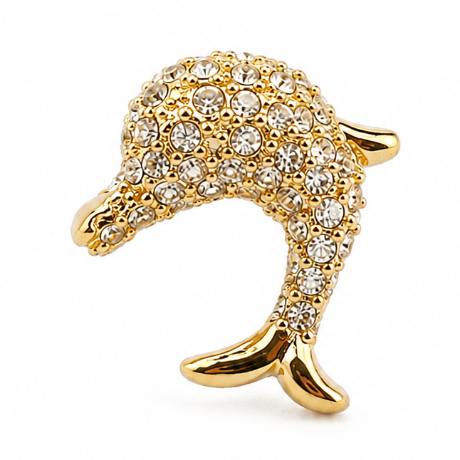 Gold dolphin jewellery charm embellished with multiple clear crystal stones on a white background.
