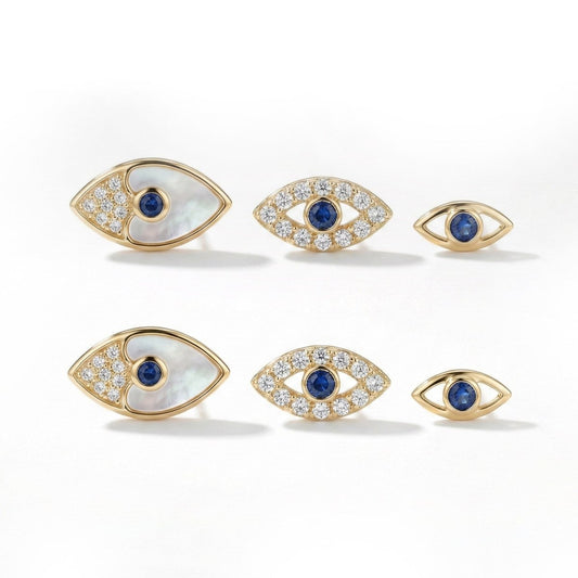 Dainty evil eye earring set with mother-of-pearl and crystal detailing, finished with an anti-tarnish gold finish, perfect for everyday wear and meaningful styling.
