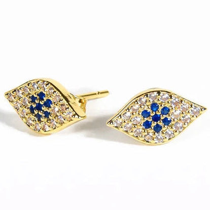 Gold-tone leaf-shaped stud earrings featuring a pavé design with clear crystals and clustered blue stones, set in an organic pointed silhouette.