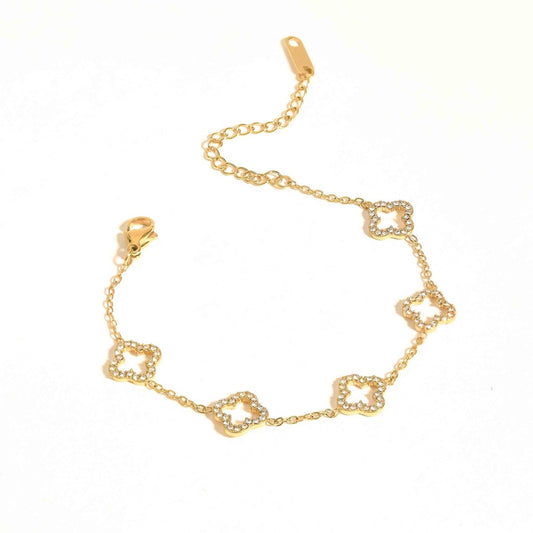 Clover charm bracelet with sparkling crystal detailing and an anti-tarnish gold-plated finish, perfect for everyday wear, elegant styling, and thoughtful gifting.
