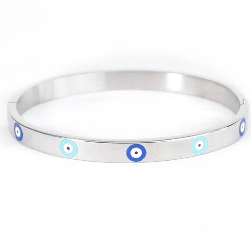 Silver-tone evil eye bangle featuring five evenly spaced blue and turquoise evil eye details along the front.