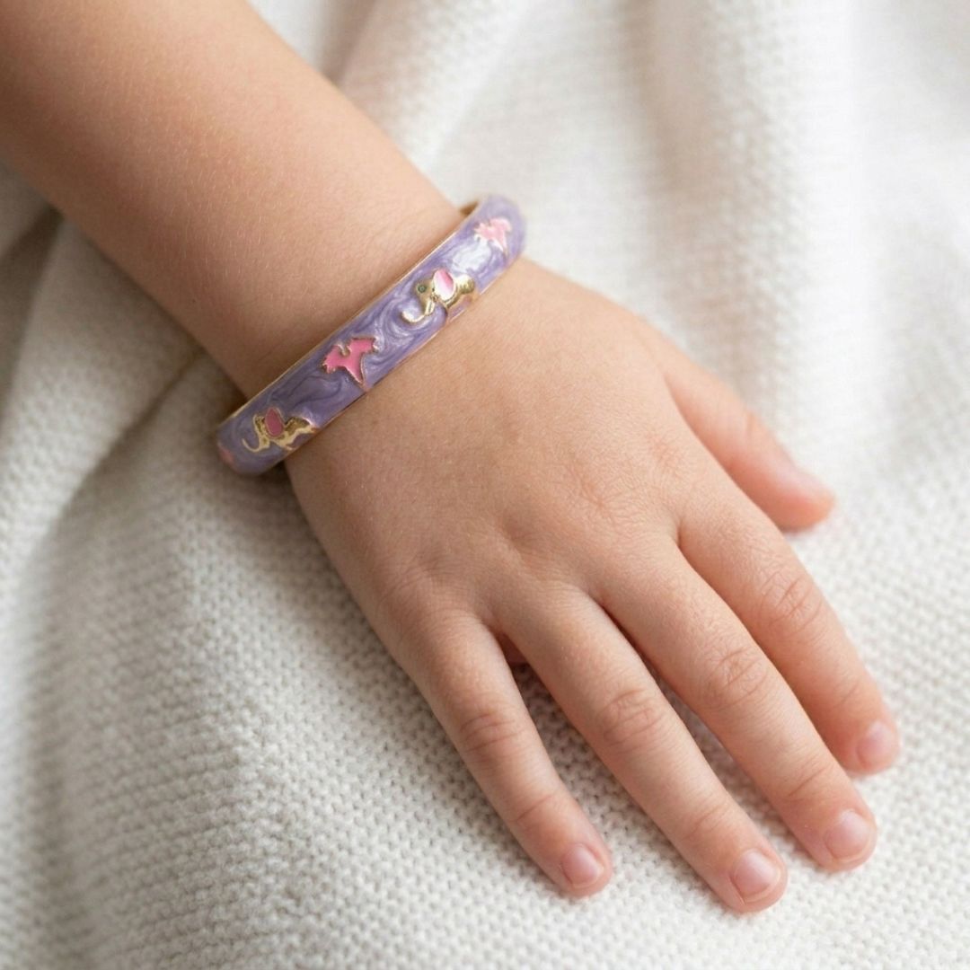 Kids' floral enamel bangle with colorful pastel flower detailing and an anti-tarnish gold finish, perfect for comfortable everyday wear, playful styling, and special occasions.