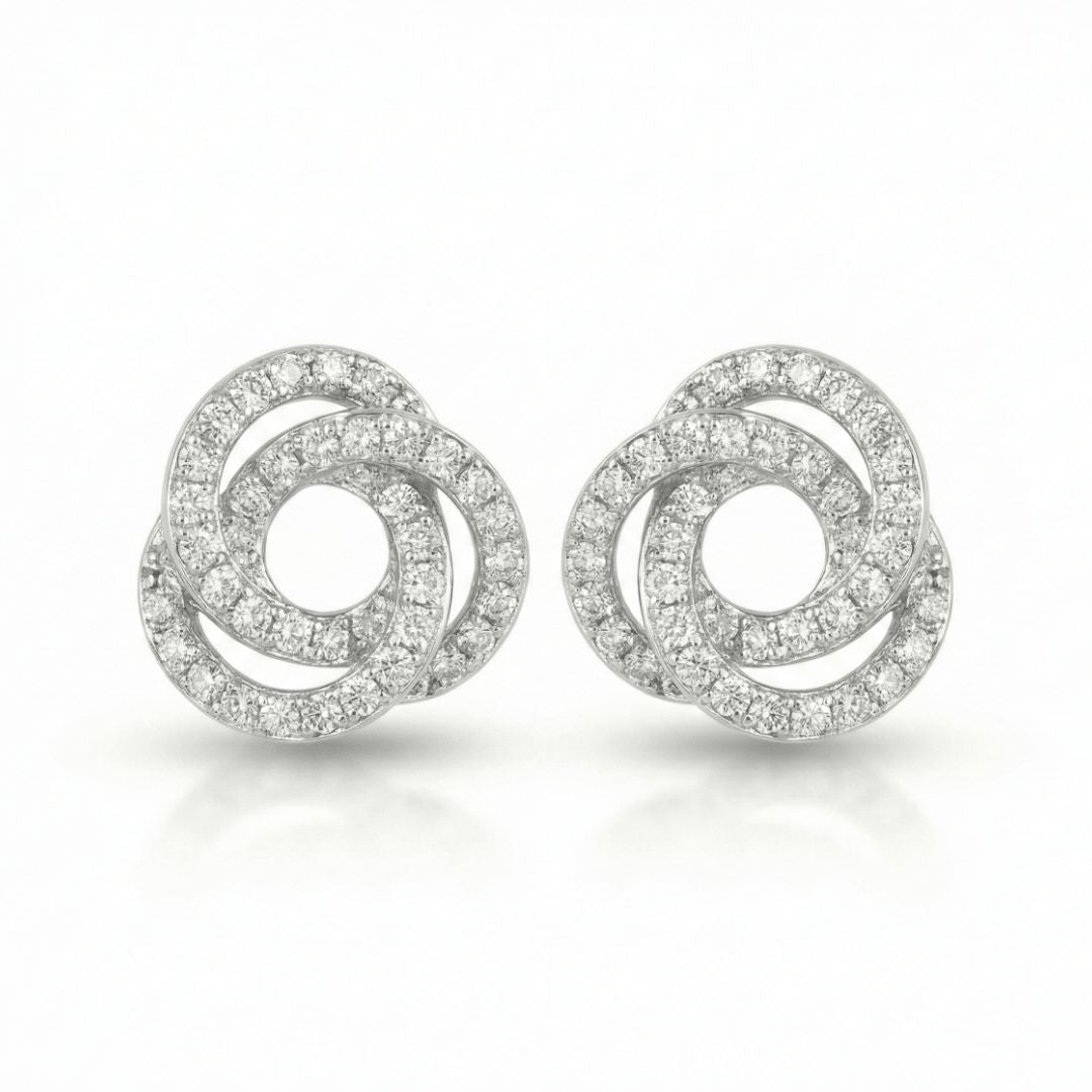 Gilded orbit studs with sparkling crystal detailing and an anti-tarnish silver finish, perfect for everyday wear and elegant styling.
