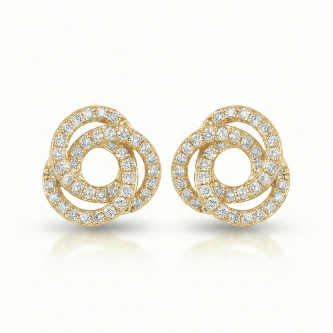 Gilded orbit studs with sparkling crystal detailing and an anti-tarnish silver finish, perfect for everyday wear and elegant styling.
