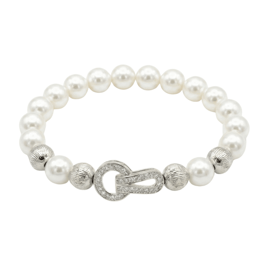 Pearl bracelet with an interlocking crystal clasp and an anti-tarnish gold-plated finish, perfect for everyday wear and elegant styling.