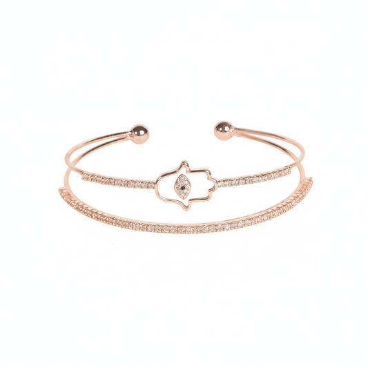 Hamsa cuff bangle with crystal detailing and an anti-tarnish rose gold finish, perfect for everyday wear, meaningful styling, and elegant layering.
