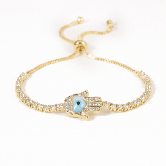 Hamsa heart bracelet with mother-of-pearl and crystal detailing, finished with an anti-tarnish coating, perfect for everyday wear, meaningful styling, and thoughtful gifting.
