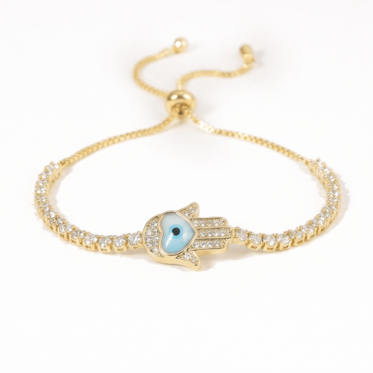 Hamsa heart bracelet with mother-of-pearl and crystal detailing, finished with an anti-tarnish coating, perfect for everyday wear, meaningful styling, and thoughtful gifting.
