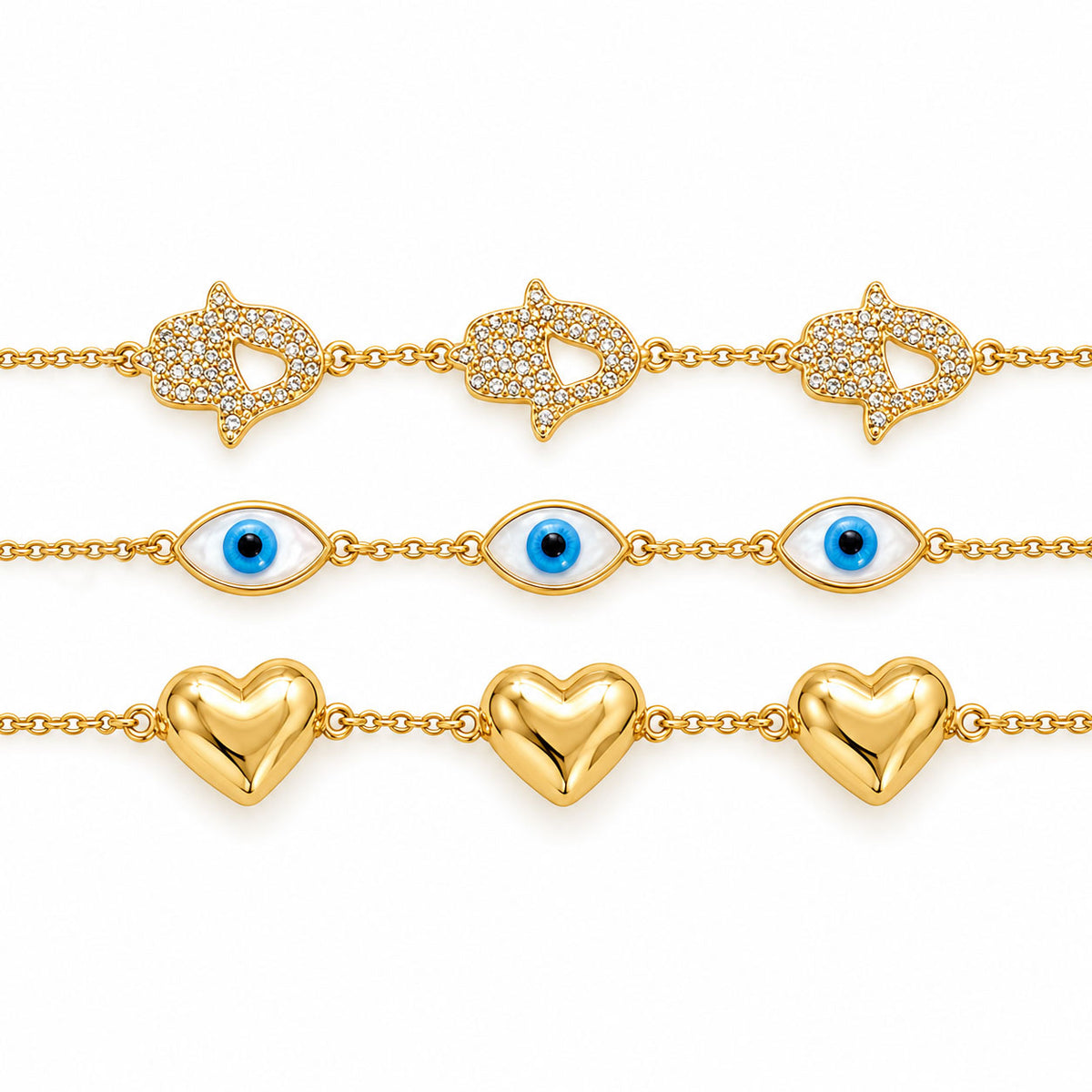 Three gold-plated chain bracelets displayed horizontally on a clean white background: a crystal-studded star-and-heart bracelet, a blue Evil Eye bracelet, and a polished gold heart bracelet.