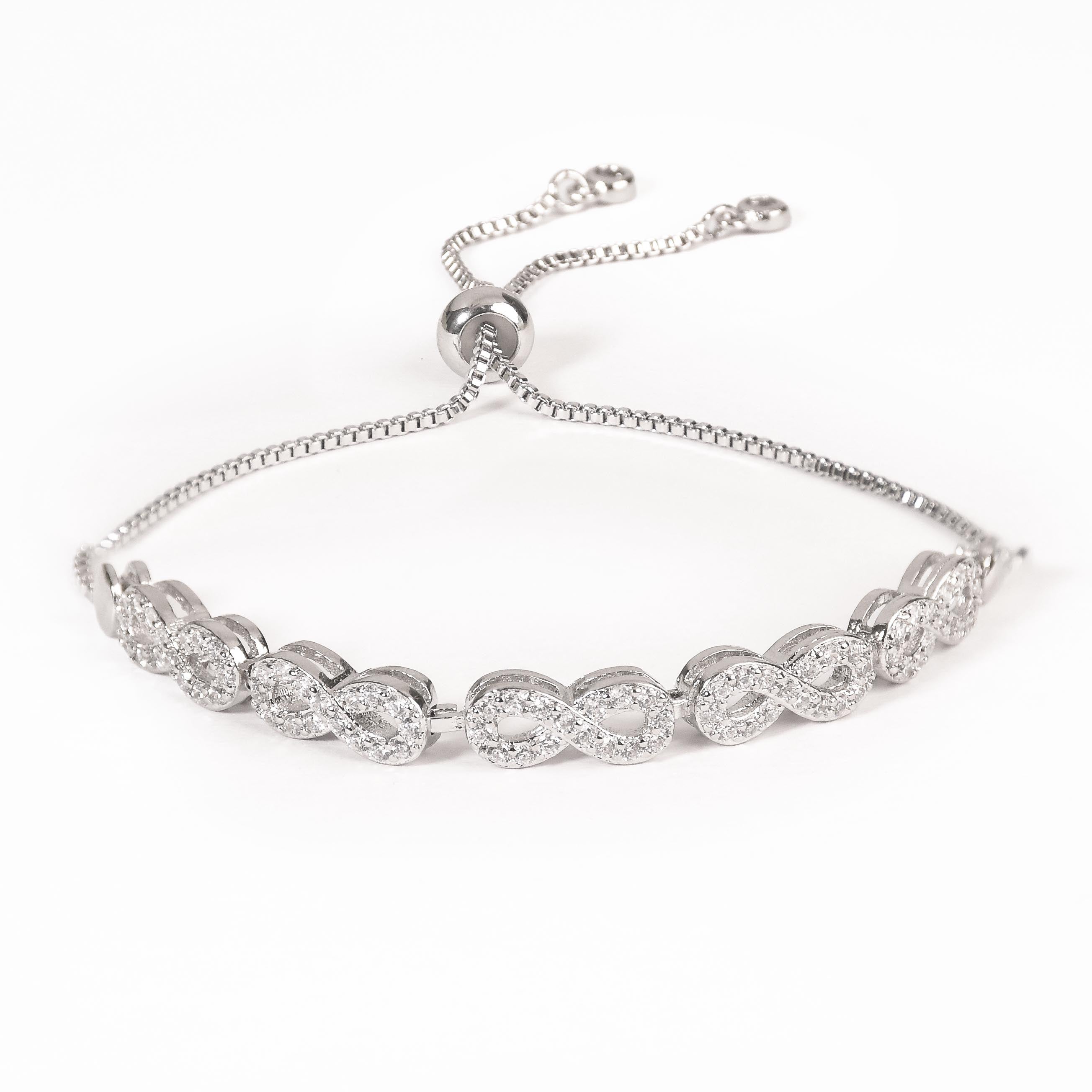 Infinity bracelet with crystal detailing and an anti-tarnish finish, available in gold and silver, perfect for everyday wear and elegant styling.
