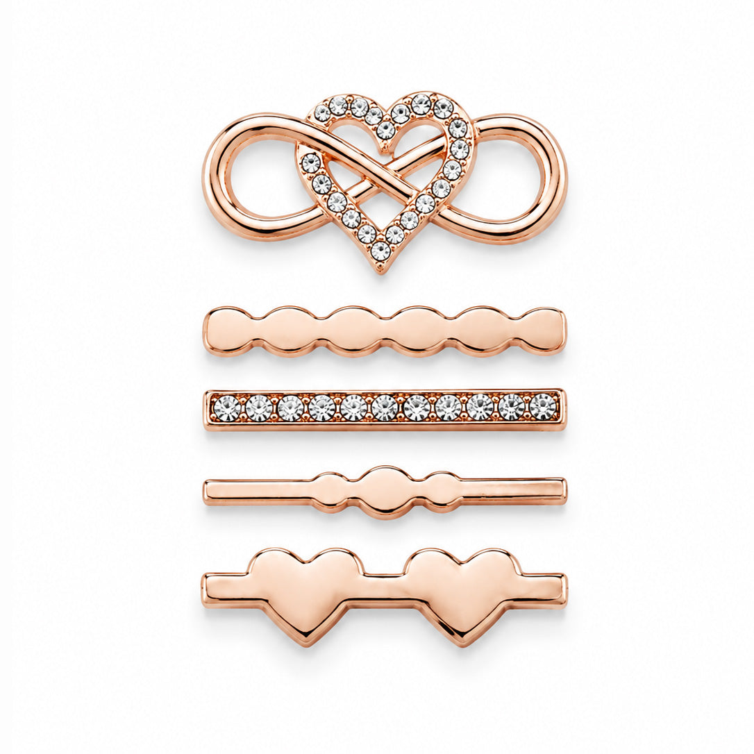 A gold heart-shaped pendant with an open heart outline and a dangling letter 'J' embellished with small clear stones, shown on a plain white background.
