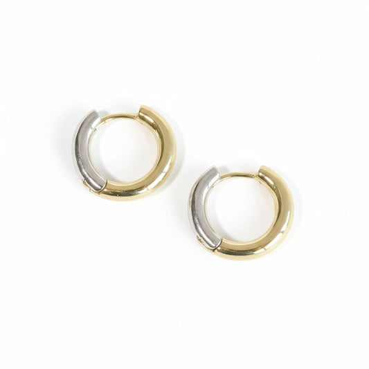 Metallic glide hoop earrings with a two-tone sculptural design and an anti-tarnish finish, available in gold and silver, perfect for everyday wear and modern styling.
