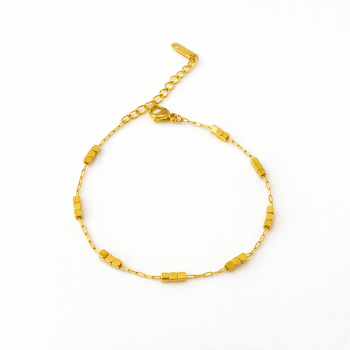 Petite pixel bracelet with geometric bead detailing and an anti-tarnish finish, available in gold and silver, perfect for everyday wear and minimalist styling.
