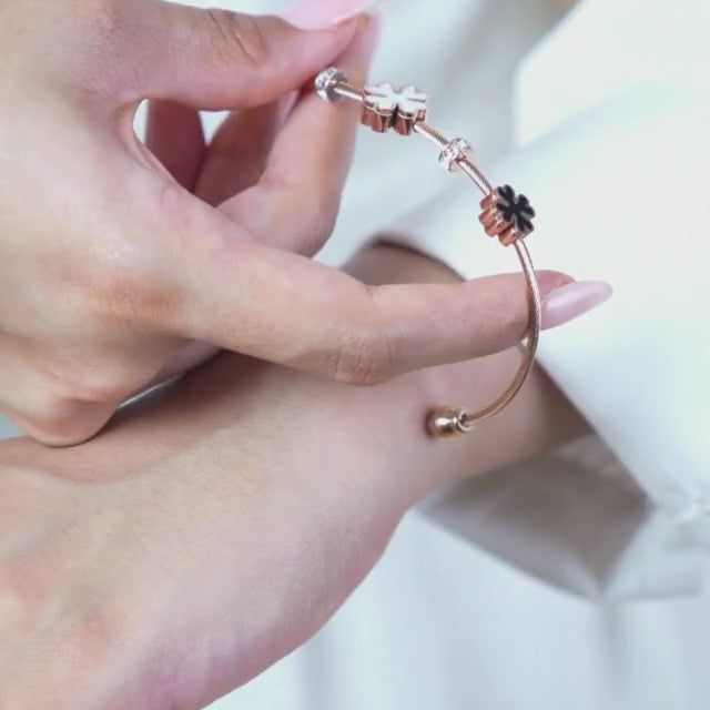 Elegant rose gold floral bangle with a dainty anti-tarnish finish and magnetic lock design, perfect for everyday wear, effortless stacking with bracelets, and timeless styling.
