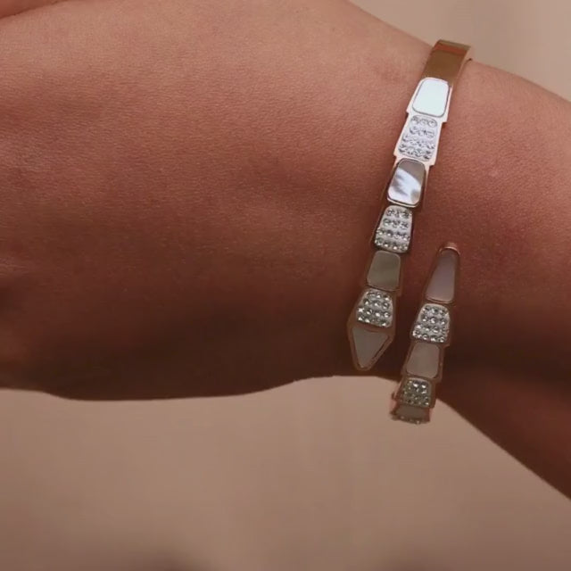 Elegant rosegold snake bracelet with mother-of-pearl detailing and an anti-tarnish finish, perfect for everyday elegance, gifting, and chic statement styling.
