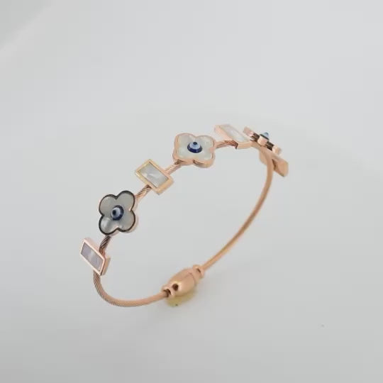 Elegant rosegold flower bangle with mother-of-pearl detailing, a secure magnetic lock, and an anti-tarnish finish, perfect for everyday chic styling and effortless elegance.
