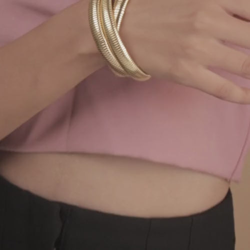 Chunky layered twisted bangle with a bold stacked design and anti-tarnish finish, available in gold and rose gold, perfect for everyday wear, statement styling, and modern layered looks.
