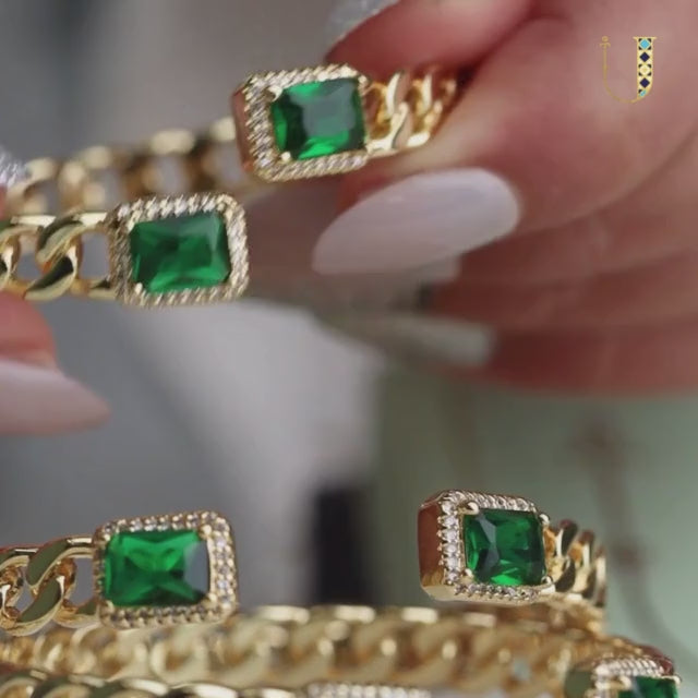 Elegant golden emerald loop bangle with a chic chain-link design and adjustable anti-tarnish finish, perfect for everyday elegance, special occasions, and stylish stacked looks.