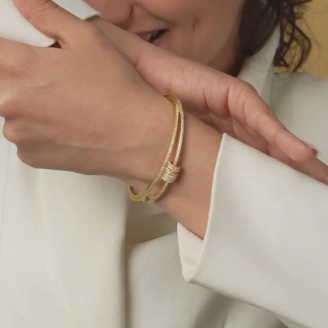 Elegant seven-ring bangle with sparkling stone detailing and an anti-tarnish finish, designed for everyday wear, effortless stacking, and timeless statement styling.