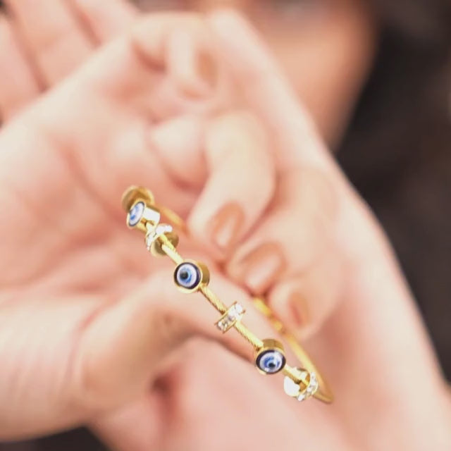 Elegant dainty Evil eye bangle with an anti-tarnish finish, available in rosegold, silver, and golden, perfect for stacking, everyday elegance, and chic versatile styling.
