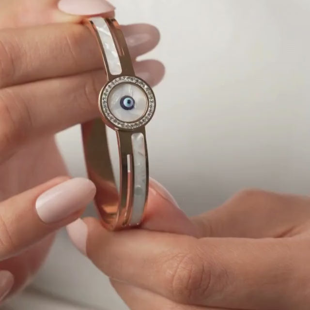 Elegant golden evil eye bangle with intricate detailing and an anti-tarnish finish, perfect for everyday wear, gifting, and adding a chic protective touch to any look.
