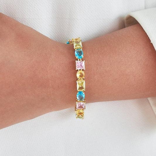 Multi stone bracelet with colorful crystal detailing and an anti-tarnish gold-plated finish, perfect for everyday wear and vibrant styling.
