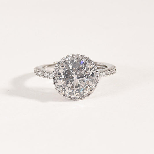 Round solitaire ring with a brilliant crystal centerpiece and an anti-tarnish silver finish, perfect for everyday wear, timeless elegance, and special occasions.
