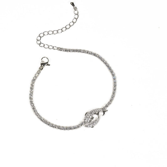 Silver dolphin bracelet with sparkling crystal detailing and an anti-tarnish finish, perfect for everyday wear and elegant styling.
