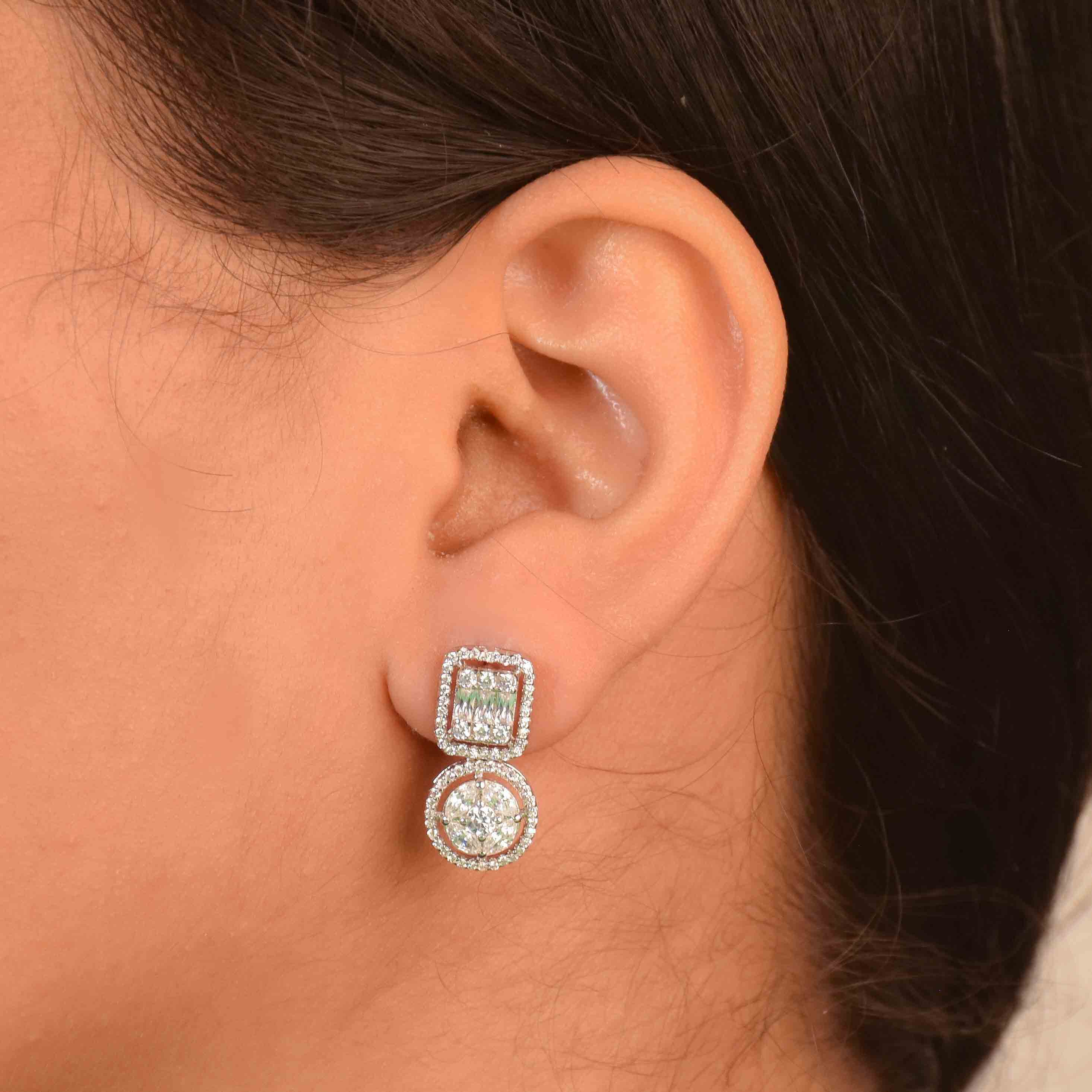 Stellar diamond earrings with geometric crystal detailing and an anti-tarnish silver finish, perfect for evening wear and elegant styling.
