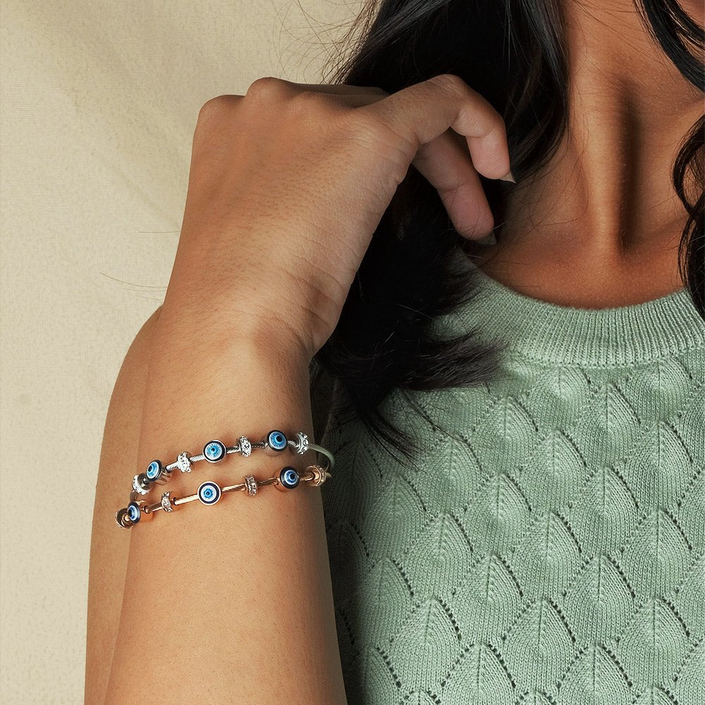 Elegant dainty Evil eye bangle with an anti-tarnish finish, available in rosegold, silver, and golden, perfect for stacking, everyday elegance, and chic versatile styling.
