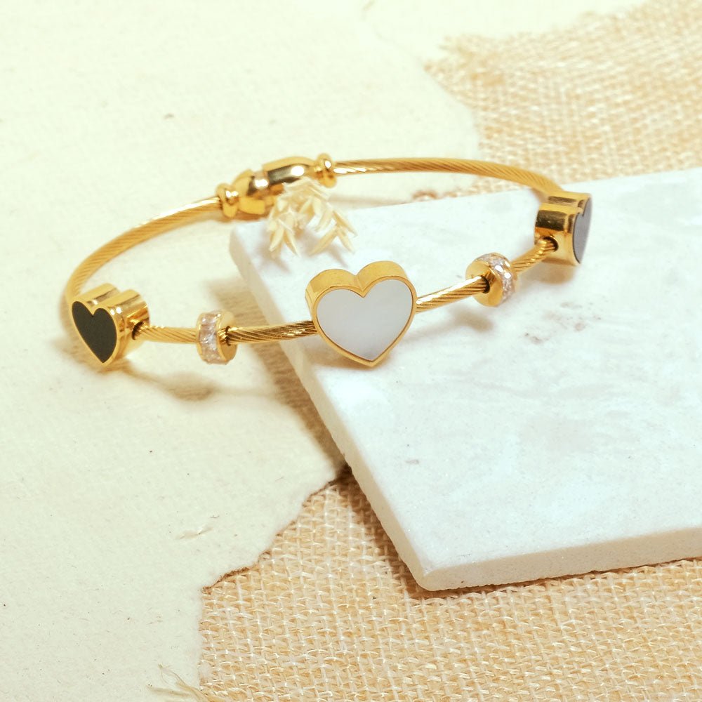 Elegant heart bangle with delicate heart detailing and an anti-tarnish finish, available in golden, silver, and rosegold, perfect for everyday elegance, parties, and thoughtful gifting.