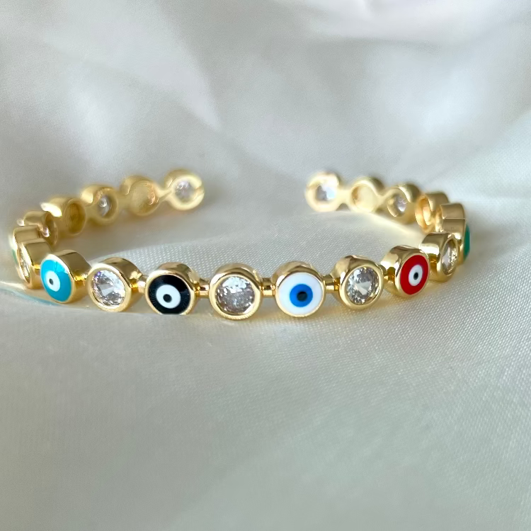 Stylish evil eye cuff bangles crafted in stainless steel with an adjustable design, available in black, blue, red, white, green, and rainbow shades, perfect for everyday wear and trendy protective styling.
