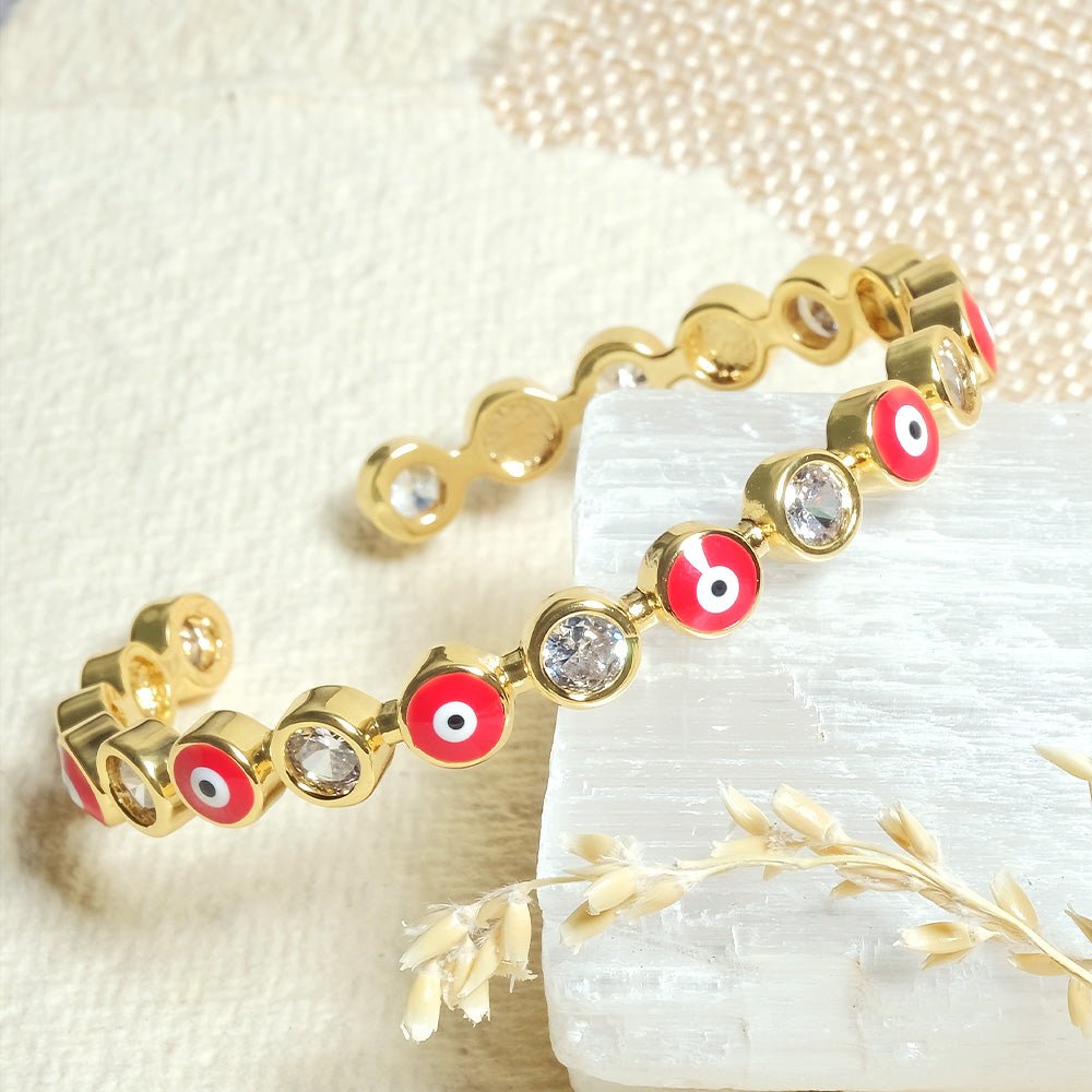 Stylish evil eye cuff bangles crafted in stainless steel with an adjustable design, available in black, blue, red, white, green, and rainbow shades, perfect for everyday wear and trendy protective styling.