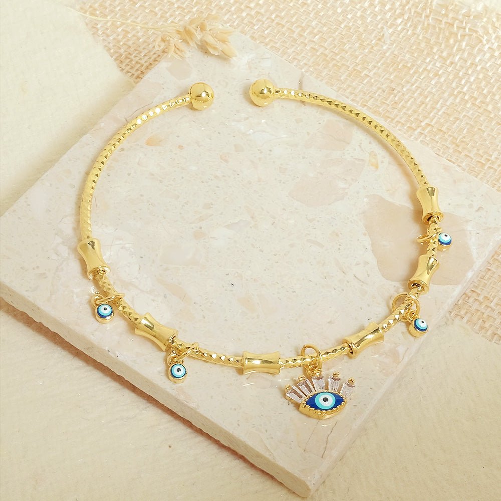 Minimal golden charm bangle with a sleek adjustable design and anti-tarnish finish, perfect for everyday wear, dainty styling, and effortless chic looks.