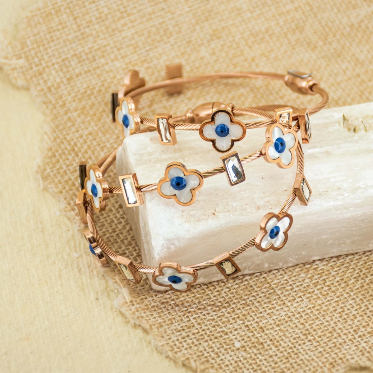 Elegant rosegold flower bangle with mother-of-pearl detailing, a secure magnetic lock, and an anti-tarnish finish, perfect for everyday chic styling and effortless elegance