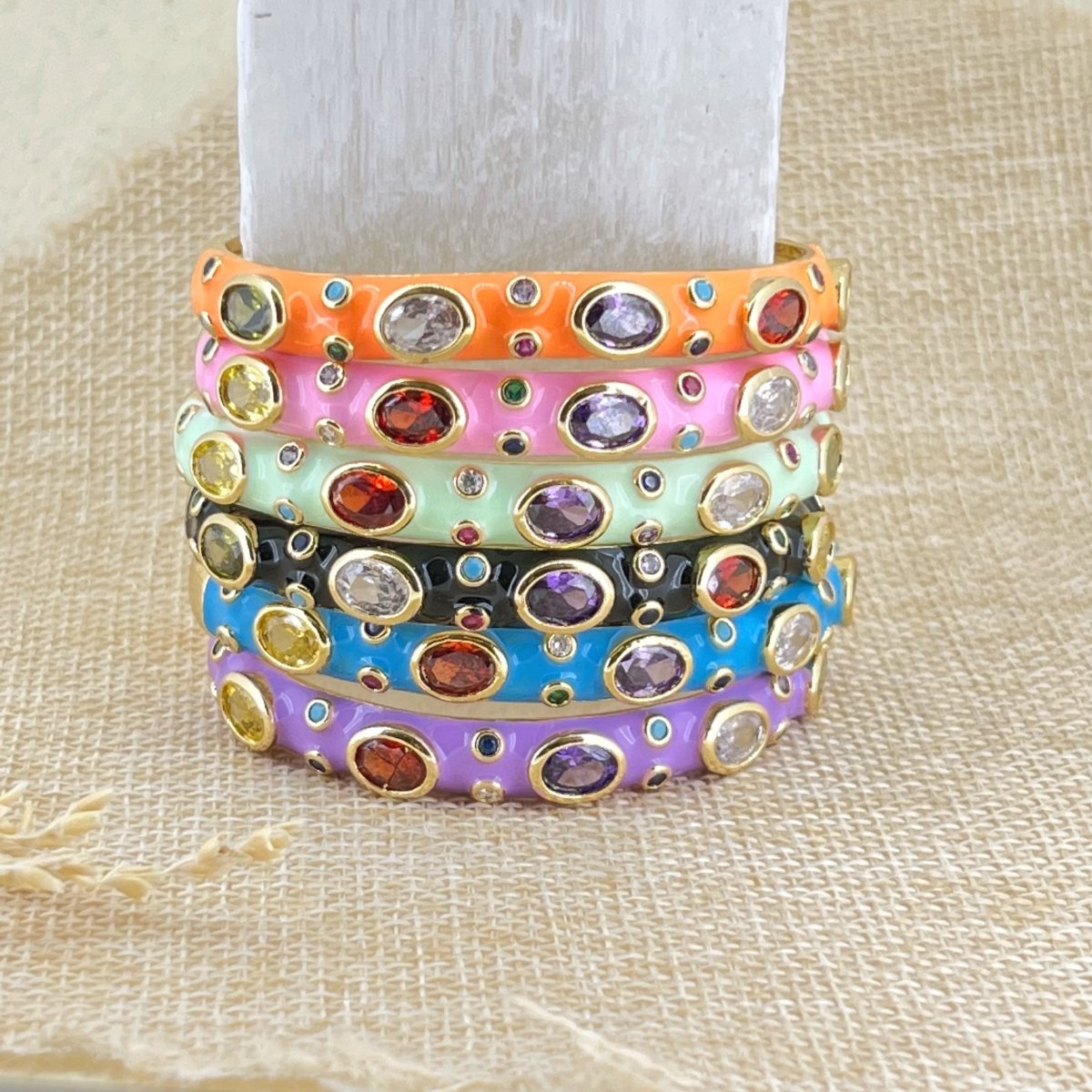 Elegant rainbow cuff bangles in soft pastel shades with an adjustable anti-tarnish finish, perfect for everyday wear, playful styling, and adding a colorful touch to any look.

