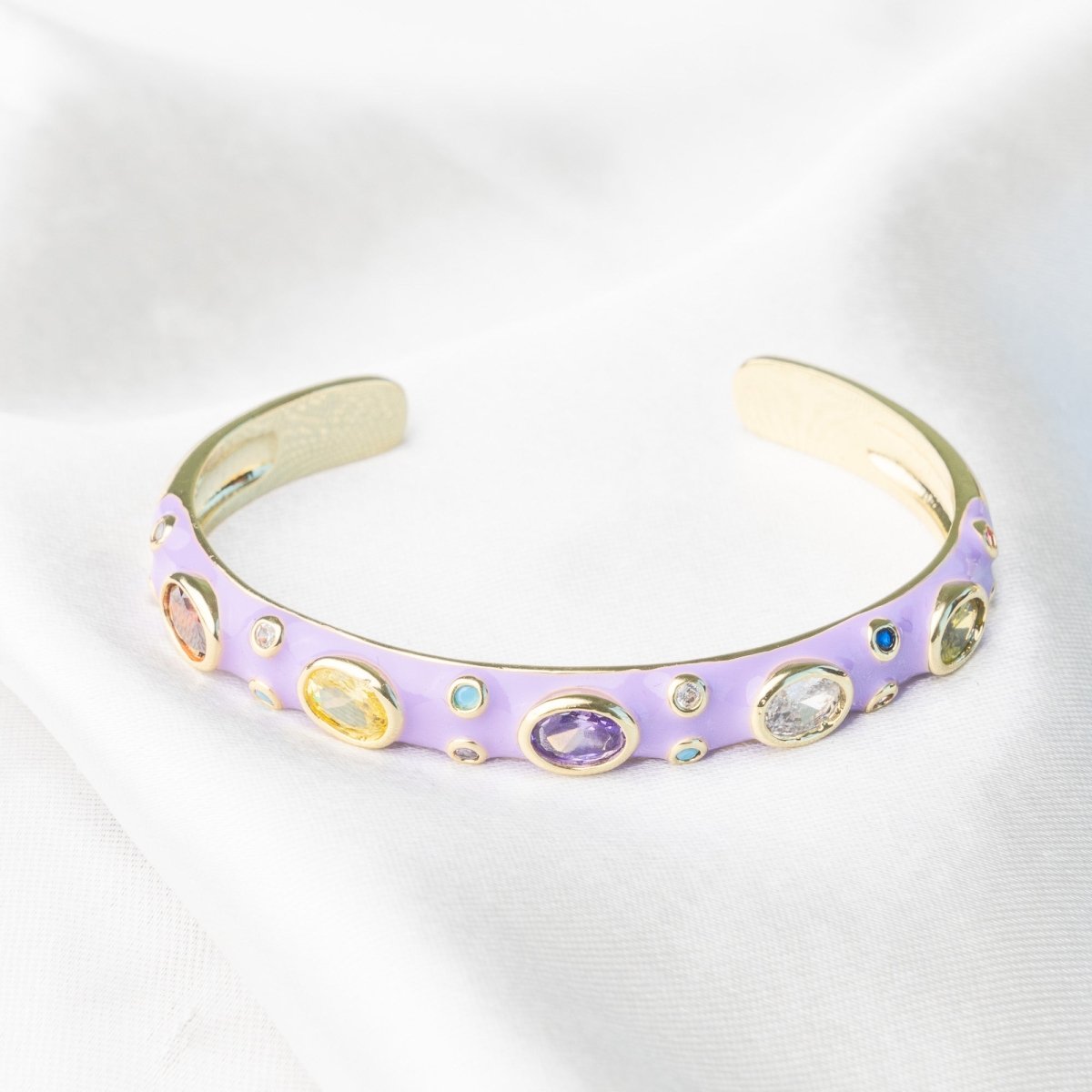Elegant rainbow cuff bangles in soft pastel shades with an adjustable anti-tarnish finish, perfect for everyday wear, playful styling, and adding a colorful touch to any look.