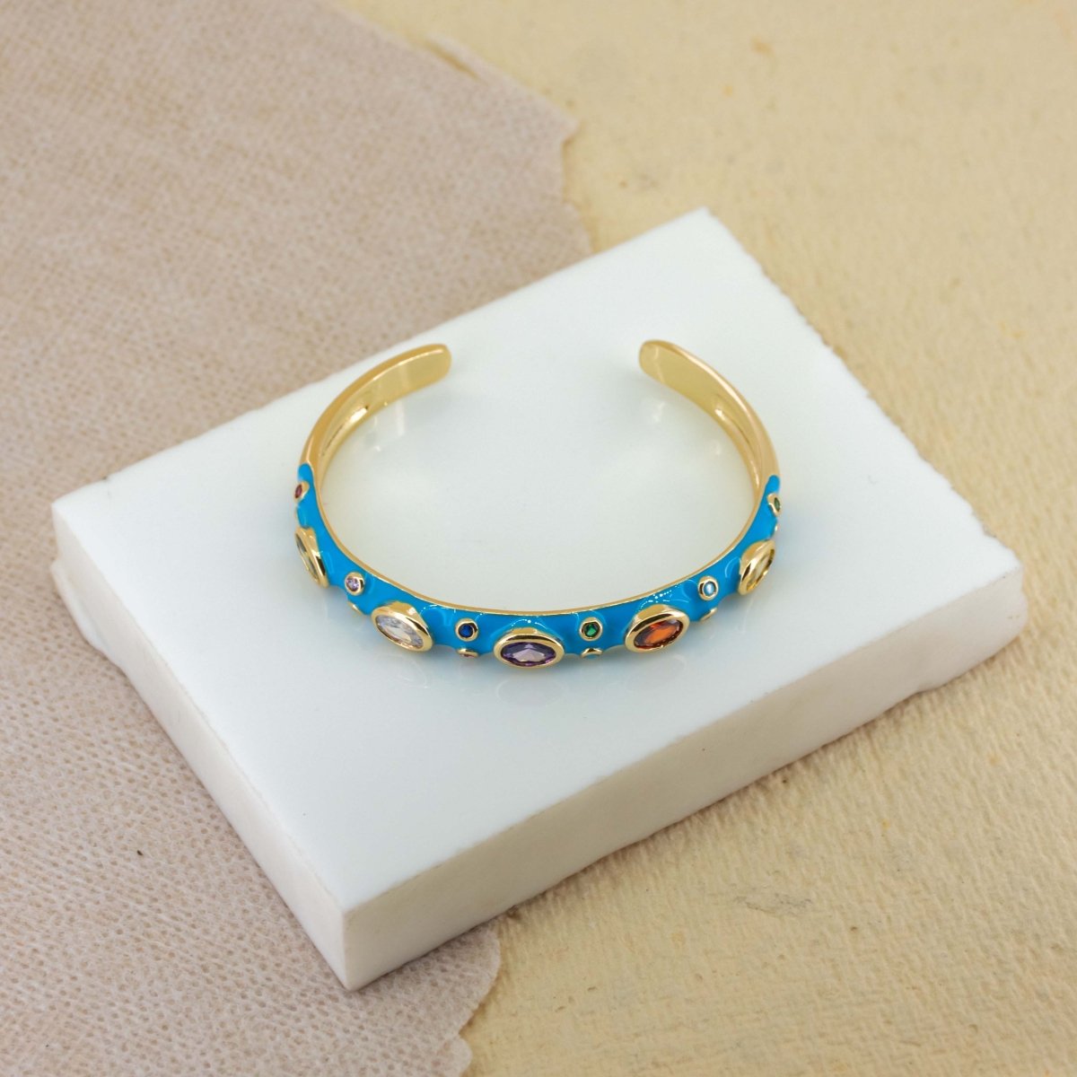 Elegant rainbow cuff bangles in soft pastel shades with an adjustable anti-tarnish finish, perfect for everyday wear, playful styling, and adding a colorful touch to any look.