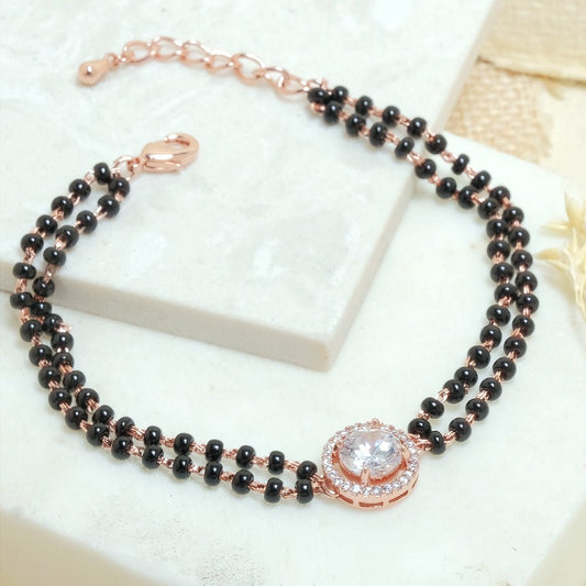 Round diamond mangalsutra bracelet with sparkling crystal detailing and an anti-tarnish rose gold finish, perfect for everyday wear and elegant styling.
